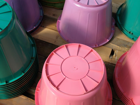 multicoloured sprayed buckets stacked upside down