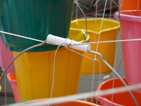 detail of buckets where tied to metal beams